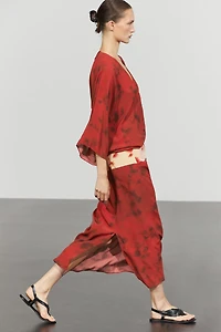 Printed flowing dress with sash detail