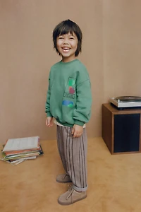 PANTALON À RAYURES ET ÉTIQUETTE