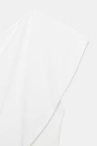 ASYMMETRIC INTERLOCK TOP