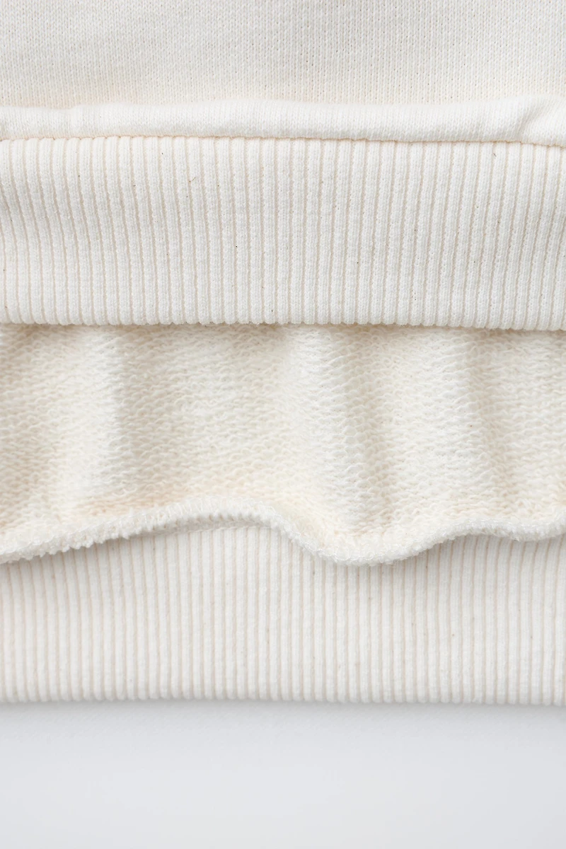 SWEAT À INSCRIPTION IMPRIMÉE POIS