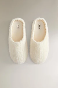 SLIPPERS WITH BRAIDED FAUX FUR DETAIL