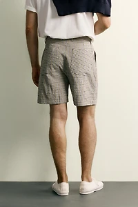 TEXTURED PLAID PLEATED SHORTS