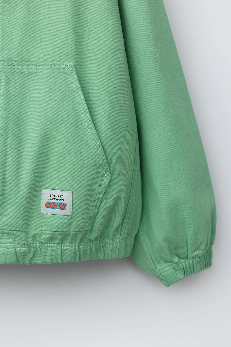 BLOUSON CAPUCHE ÉTIQUETTE