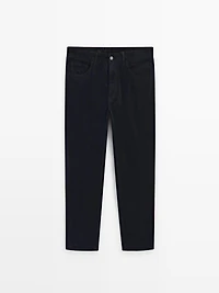 Faux jean en velours côtelé coupe slim