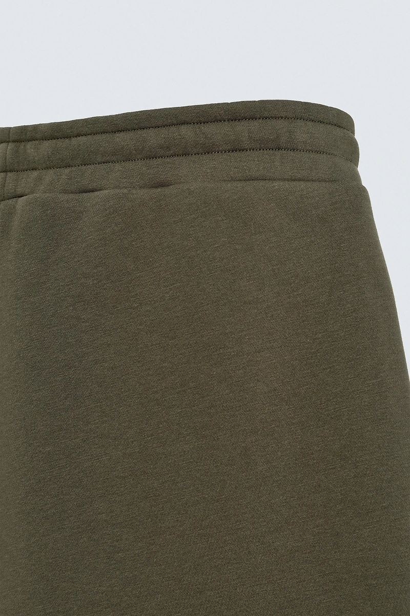 WIDE FIT NEOPRENE EFFECT PANTS WITH STUDS