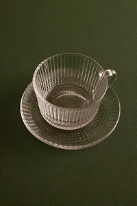 RAISED GLASS TEACUP WITH GEOMETRIC DESIGN