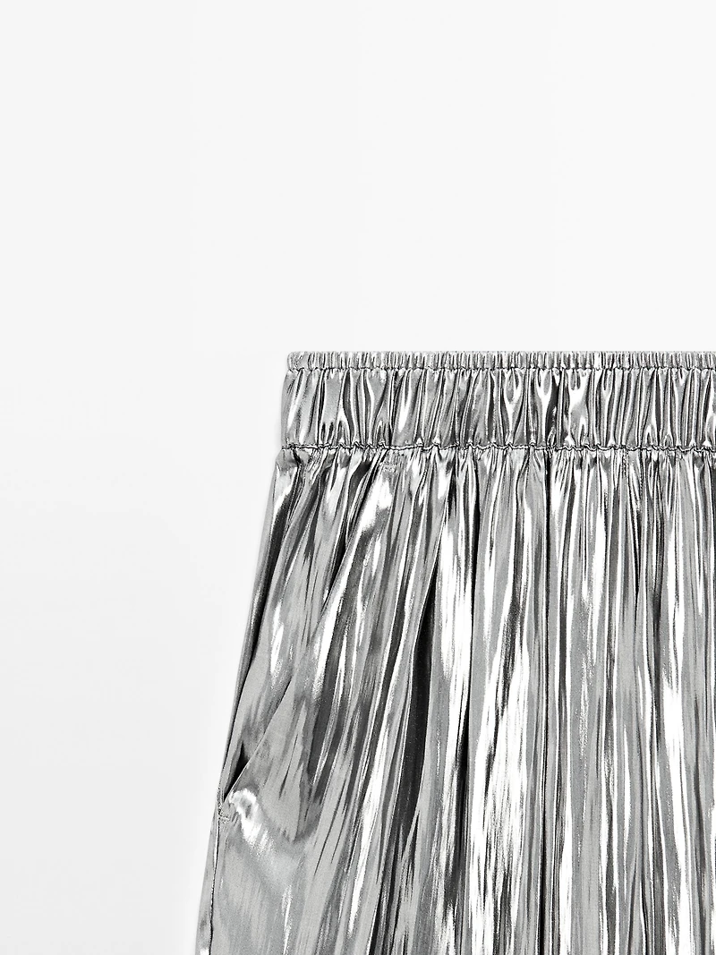 Flowing metallic trousers with gathered detail