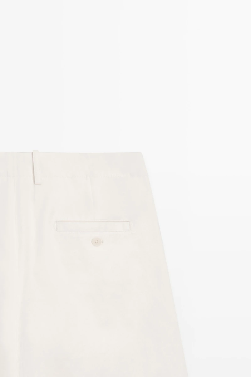 Pantalon à plis et fermeture croisée - STUDIO