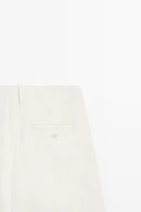 Pantalon à plis et fermeture croisée - STUDIO