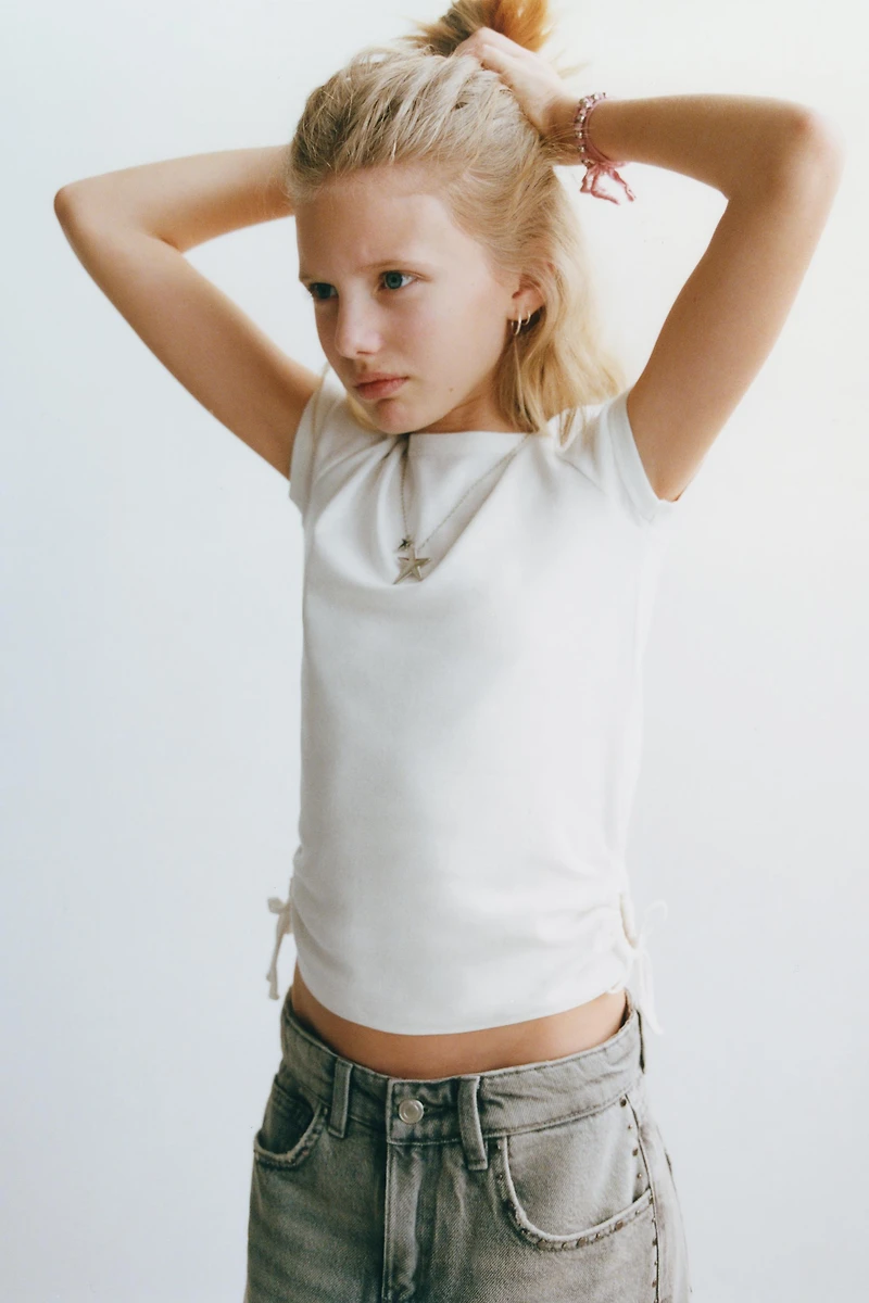 MODAL T-SHIRT WITH CUT OUTS AND BOWS