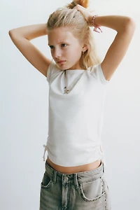 MODAL T-SHIRT WITH CUT OUTS AND BOWS
