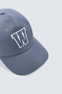 CASQUETTE TECHNIQUE AVEC PIÈCE