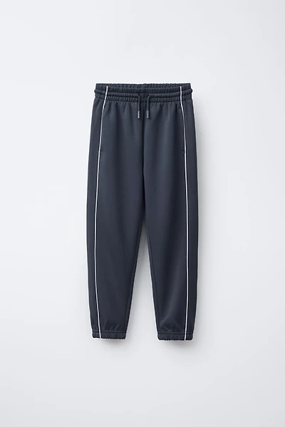 JOGGERS WITH CONTRASTING PIPING