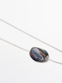 Necklace with ceramic pendant