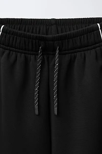 MODAL PANTS WITH CONTRASTING PIPING