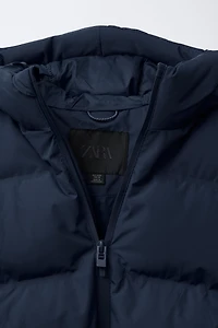 MANTEAU REMBOURRÉ ÉTIQUETTE DÉPERLANT