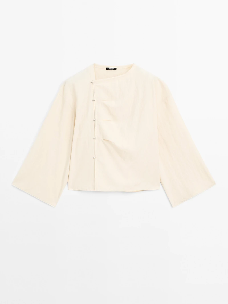 Long sleeve blouse with side button fastening