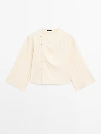 Long sleeve blouse with side button fastening