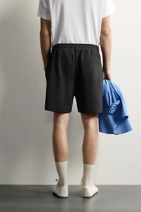 RELAXED FIT INTERLOCK TRACK SHORTS