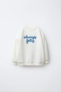 EMBROIDERED WAFFLE SWEATER