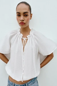 BLOUSE ROMANTIQUE À VOLANT