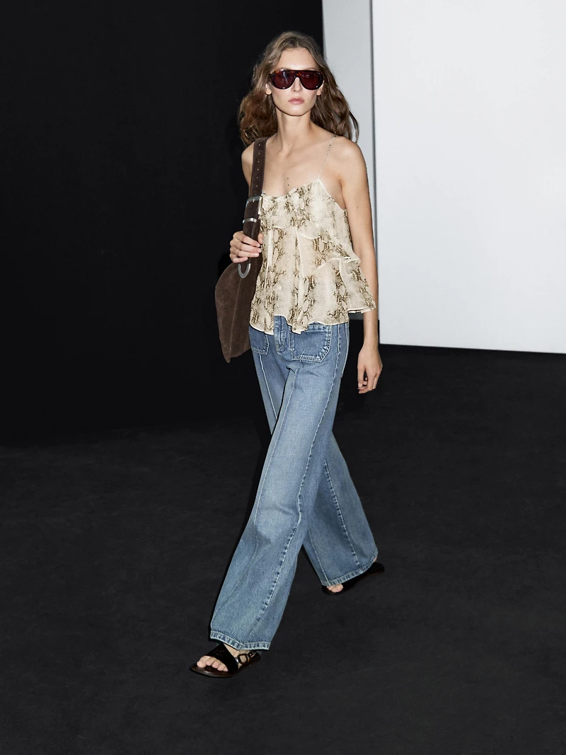 Ruffled snakeskin print top with gathered detail