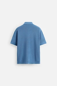 POLO EN MAILLE PERLÉE À ZIP