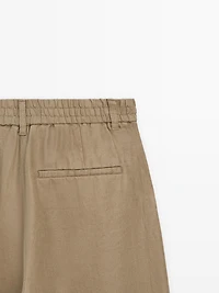100% linen wide-leg elasticated trousers