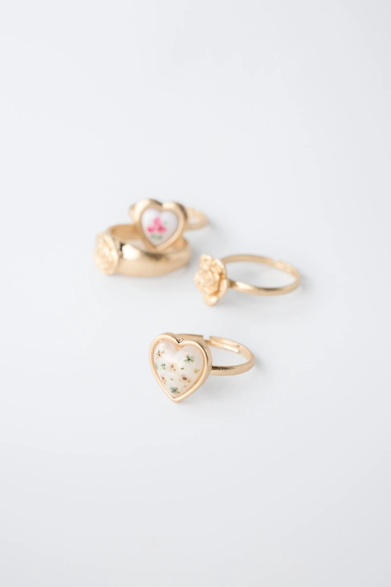 FOUR-PACK OF FLOWER AND HEART RINGS