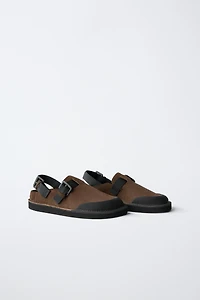 BUCKLED CLOGS