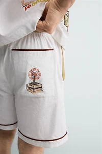 RELAXED FIT CONTRAST EMBROIDERY SHORTS