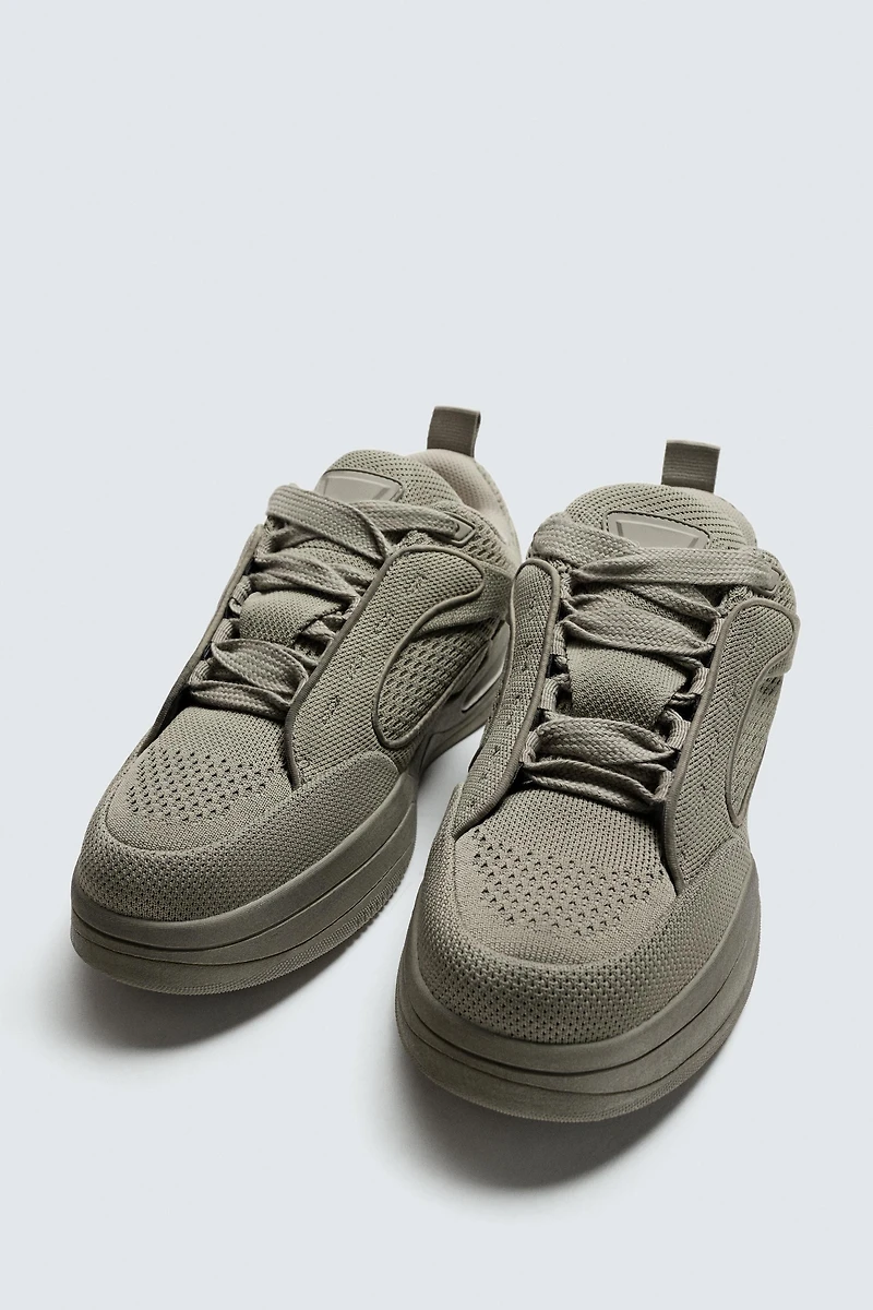 DISTRESSED THICK-SOLED SNEAKERS