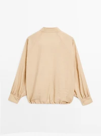 Loose-fitting bomber jacket with drawstring detail