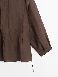 Flowing oversize linen blouse with ruffles