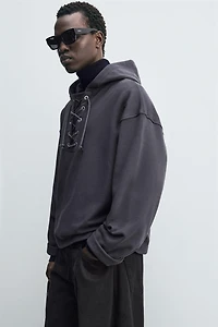 TEXTURED DRAWSTRING SWEATSHIRT