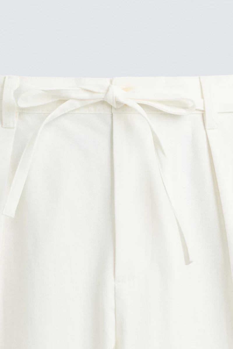 RELAXED FIT PLEATED PANTS