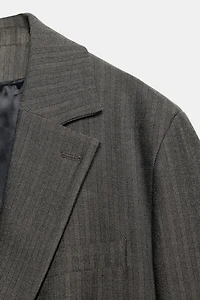 OVERSIZED MULTI-POSITION BUTTON BLAZER