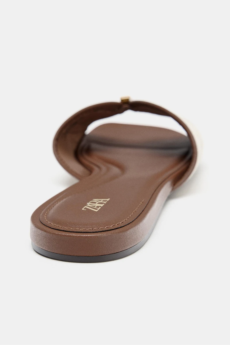 FLAT SANDALS WITH METAL DETAIL