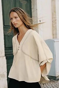 CHEMISE OVERSIZE EN LIN À SURPIQÛRES CONTRASTÉES