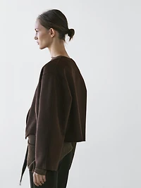 Short coat with rounded lapels