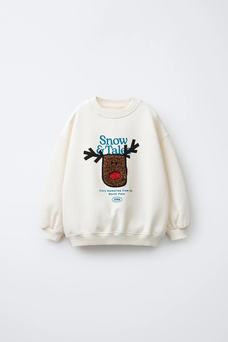 FAUX SHEARLING REINDEER PATCH SWEATSHIRT