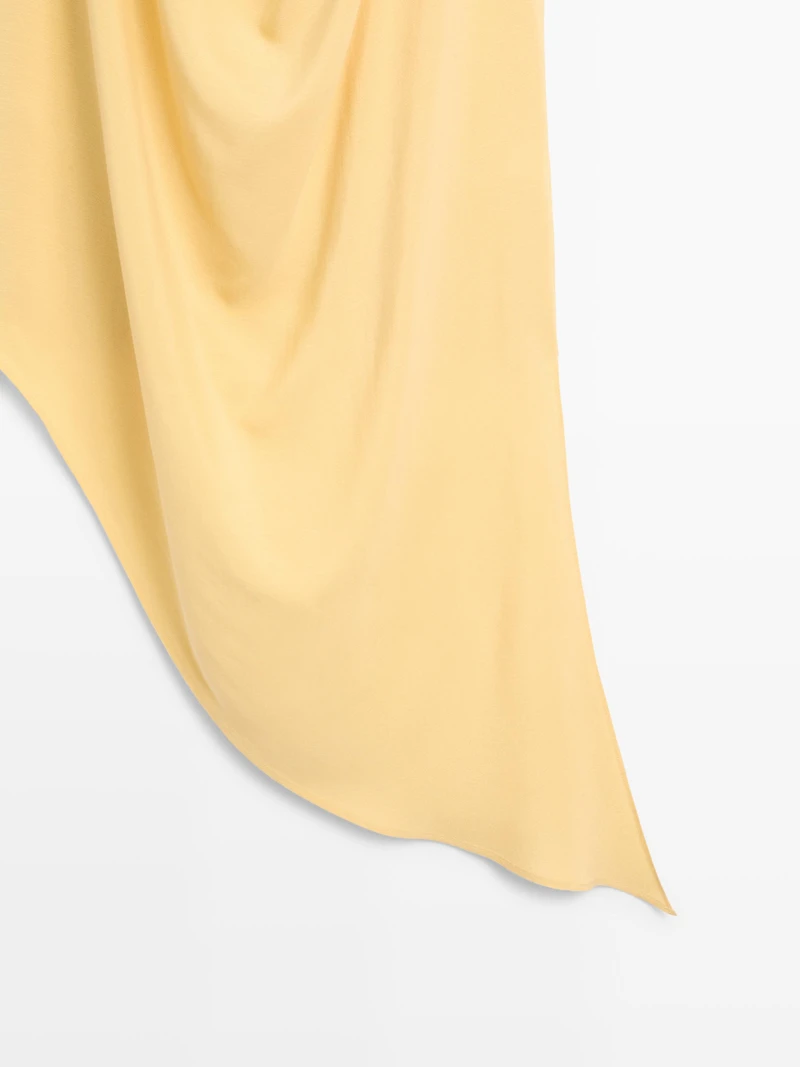 Top long fluide asymétrique