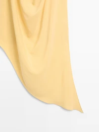 Top long fluide asymétrique