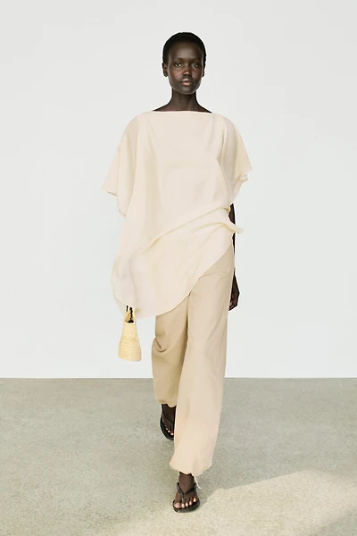 Asymmetric cape-style flowing blouse