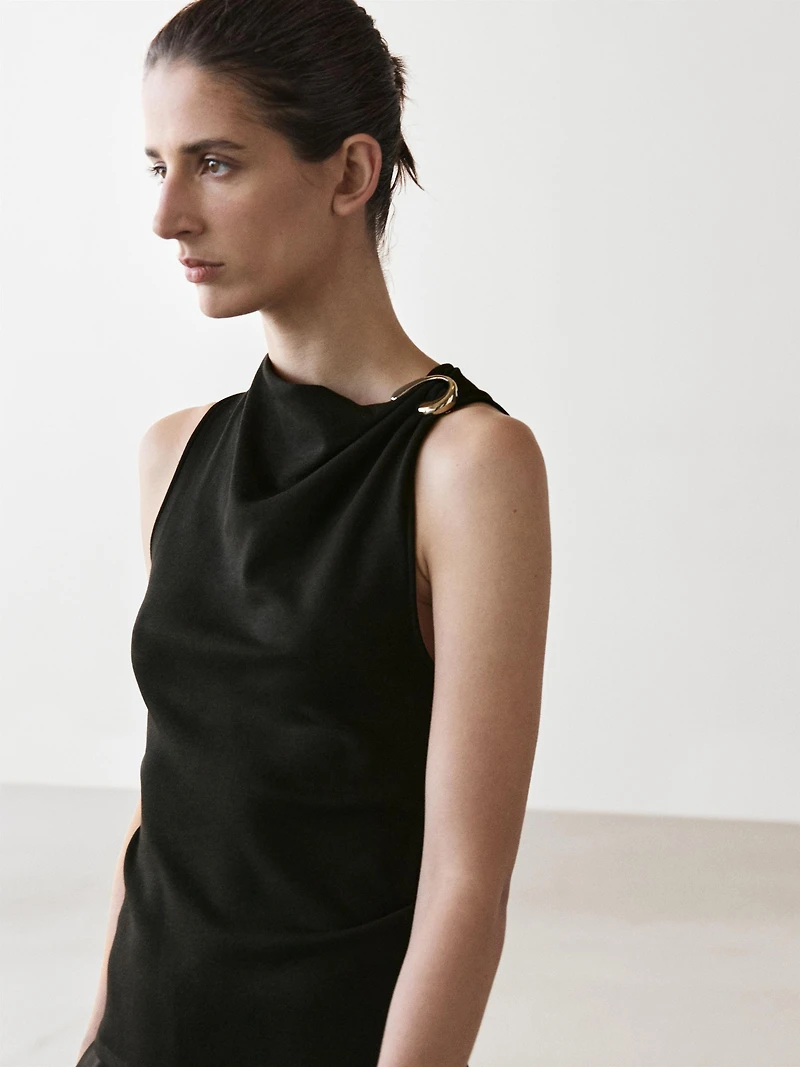 Draped neckline top with brooch detail