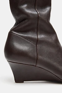 BOTTINES EN CUIR À TALONS COMPENSÉS