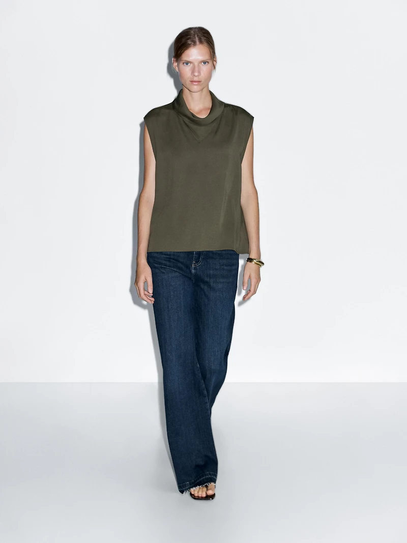 Flowing blouse with draped neck detail