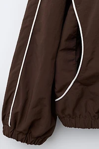 BLOUSON NYLON AVEC SAC CHAMPION ® X ZARA