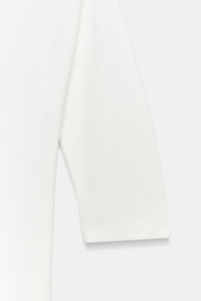 BODY RUSTIQUE À COL MONTANT