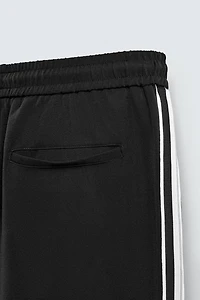 WIDE FIT JOGGER PANTS WITH SIDE STRIPES